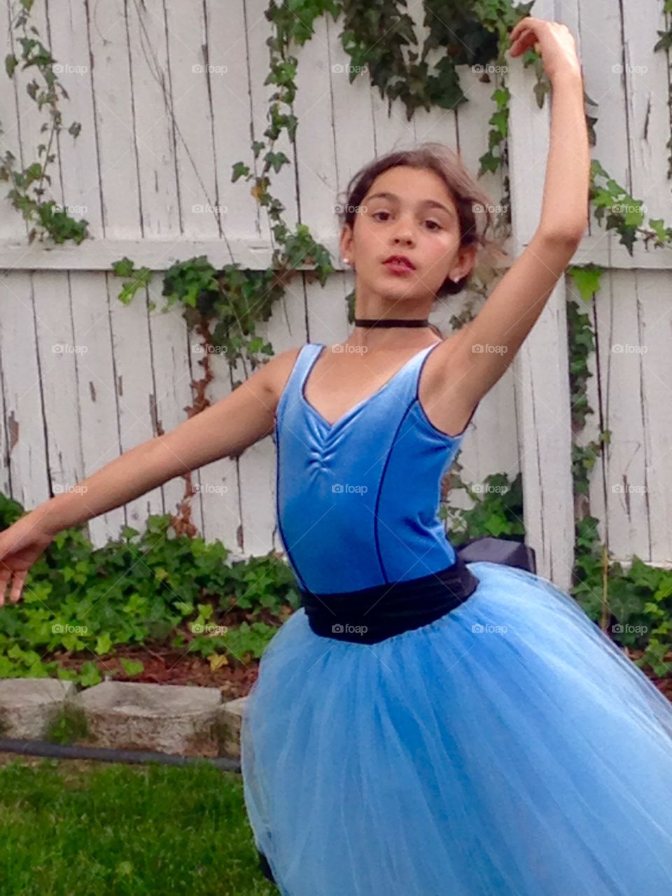 Teenager girl dancing at backyard