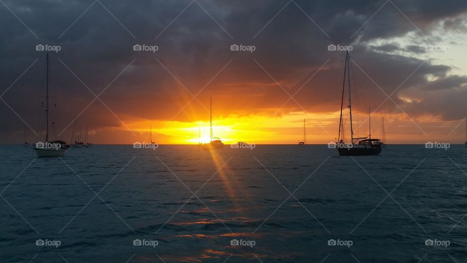 golden sunset on sailboats