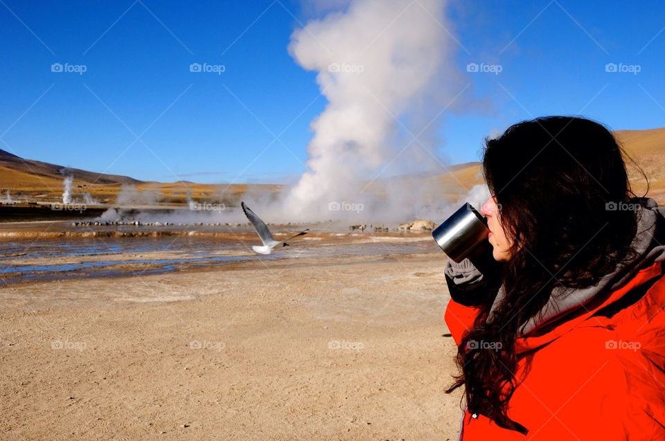 Woman drinking coffe outsite