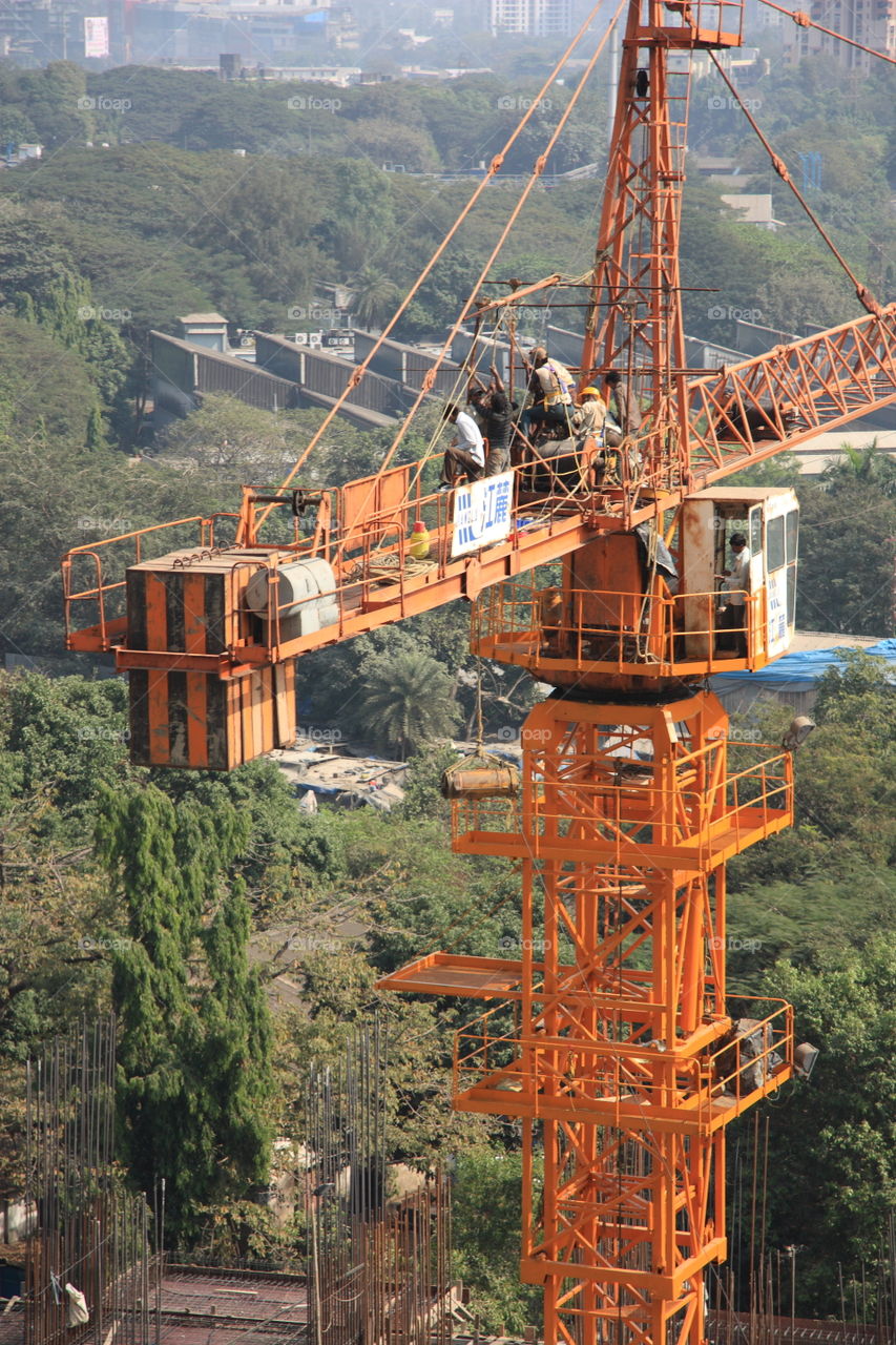 a crane working near green zone