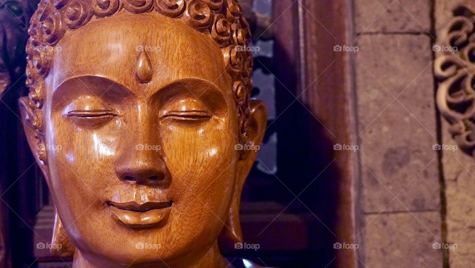 Buddha on a carved wood