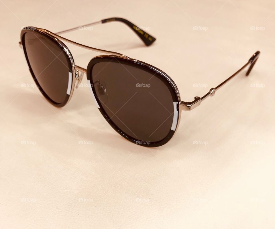 brown pilot shape sunglasses white background 