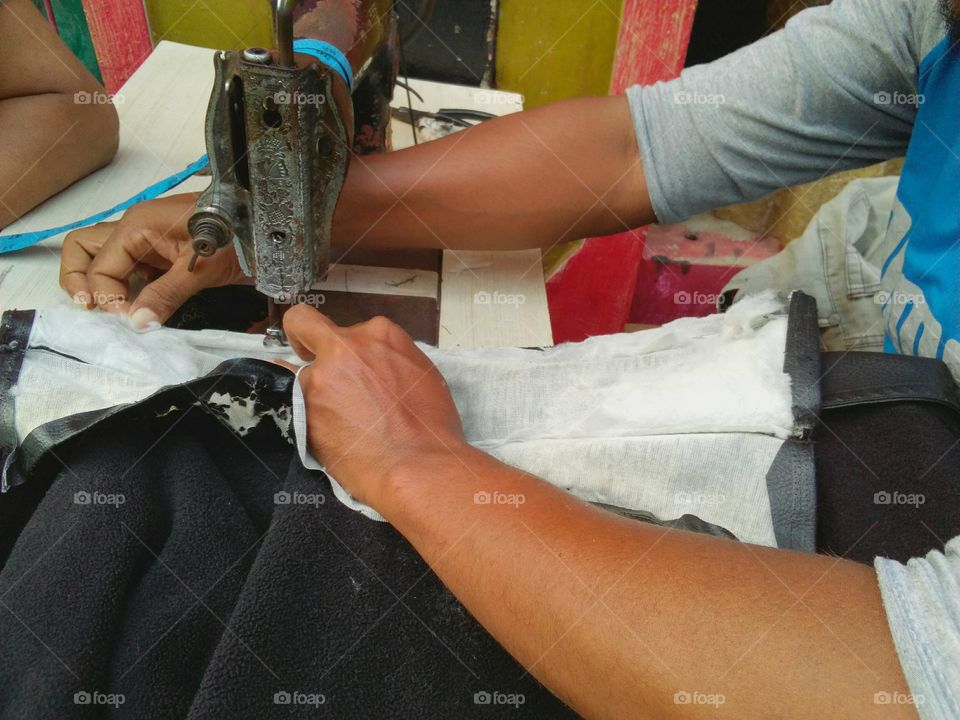 tailor working with sewing machine