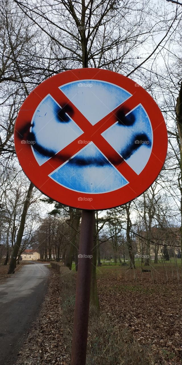 evil sign: smiling is forbidden