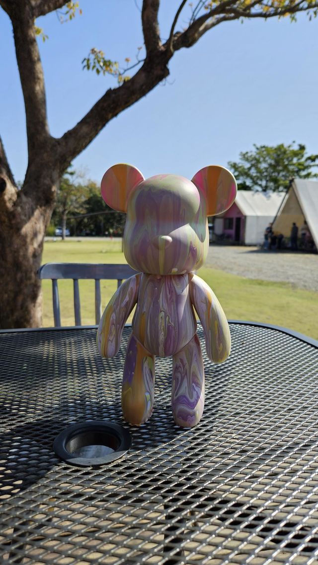 a pouring art toy bear