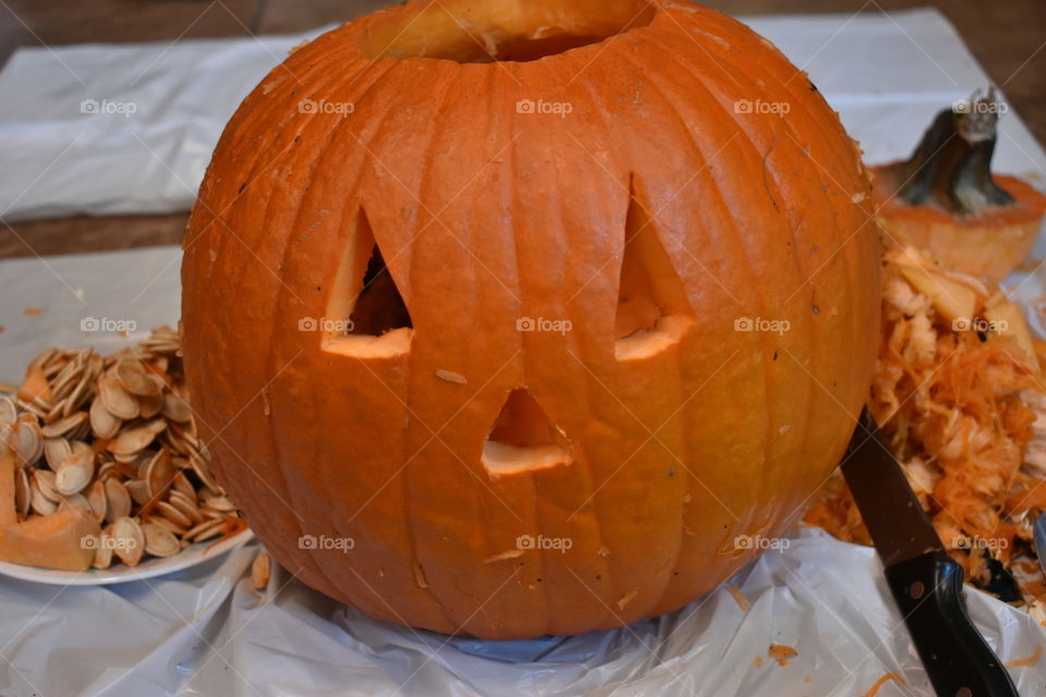 carving a halloween pumpkin