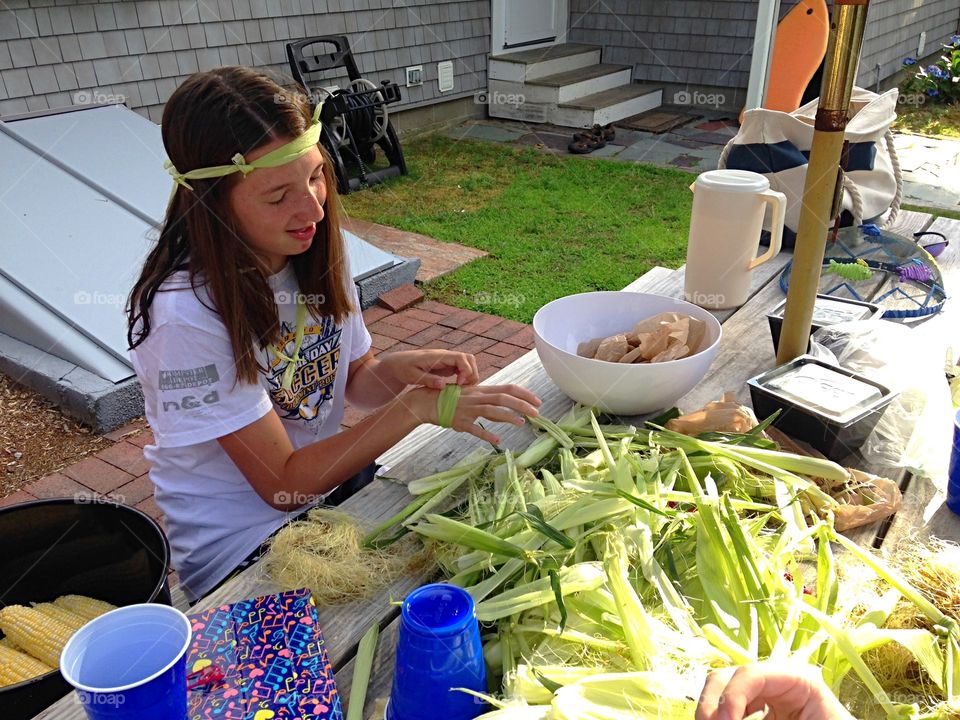 Having some fun while shucking corn  