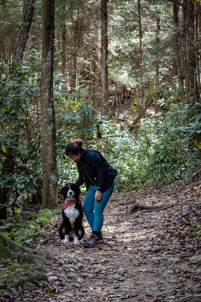 Lady hiking with her dog