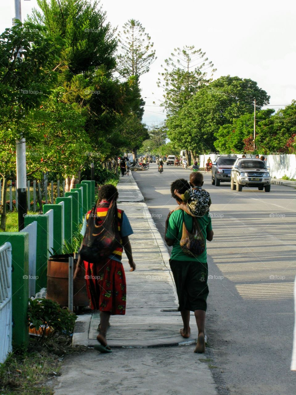 Family walking in the streets of Wamena, Papua Indonesia