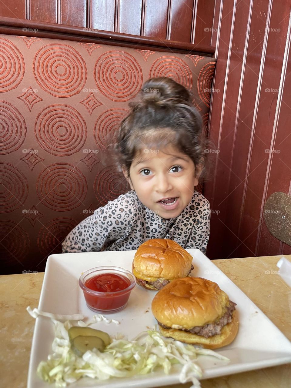 Little girl acts silly with hamburger, silly toddler at Cheesecake Factory, eating out with Mommy, eating lunch with toddlers