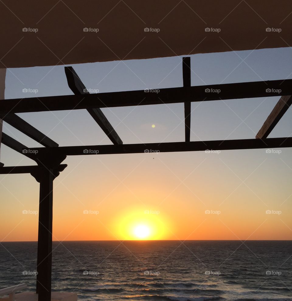 Sunrise view from a balcony overlooking the sea