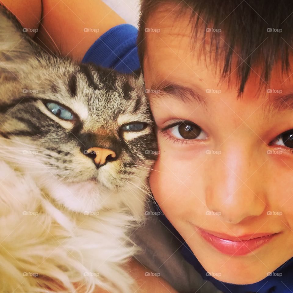 boy and his pet cat.