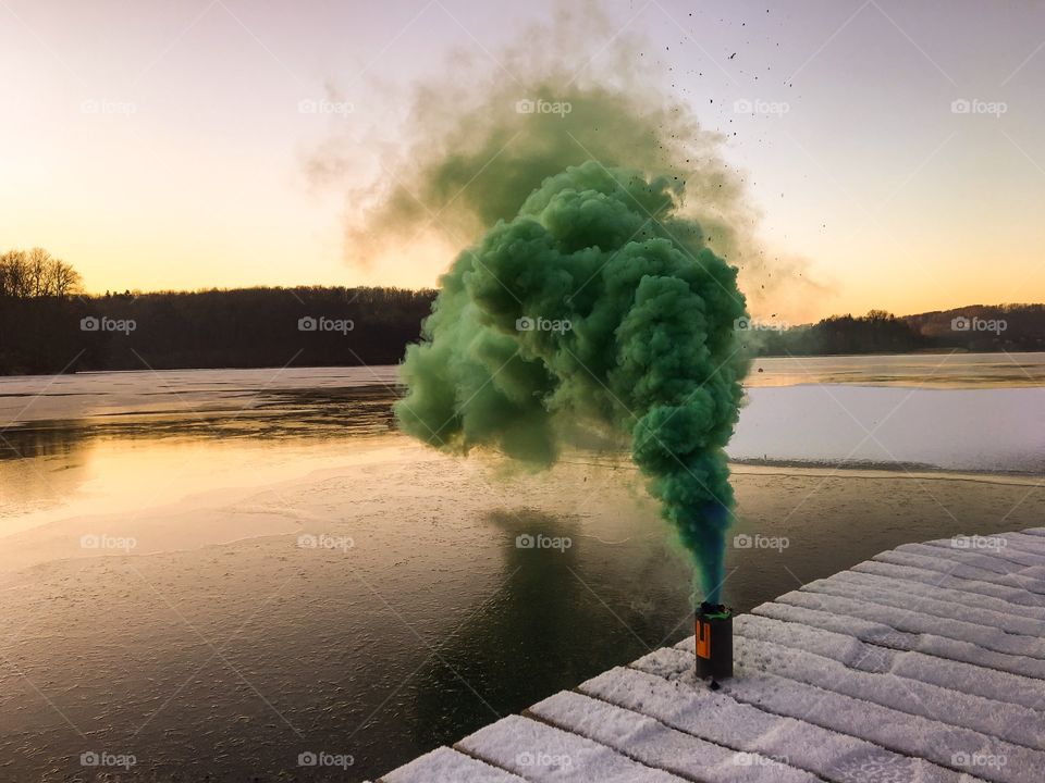 Smoke stack with green smoke billowing out