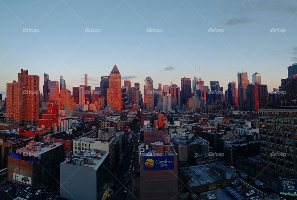 New York cityscape at sunset. Taken from the top roof bar 'The Press Lounge'