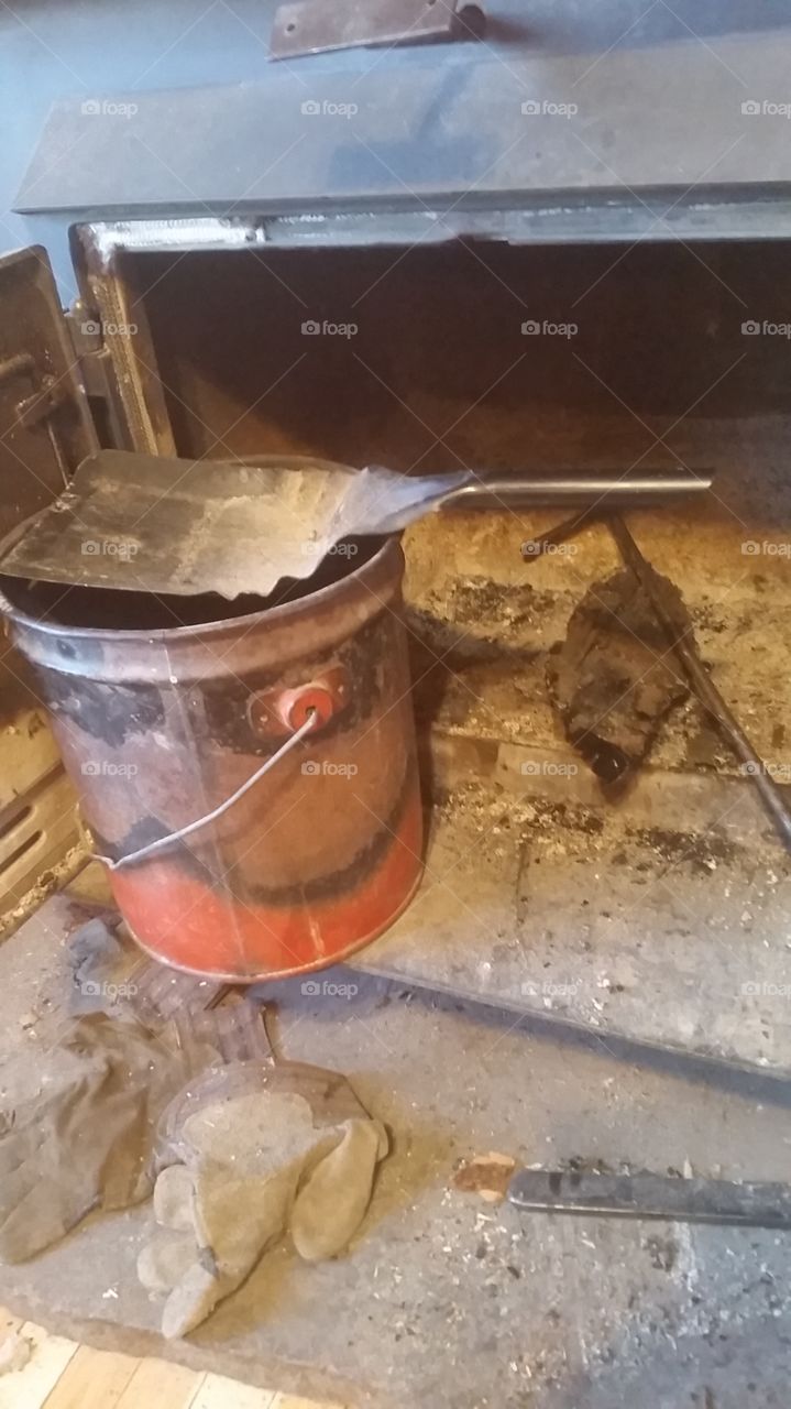 Wood stove fireplace scooper bucket with tools.