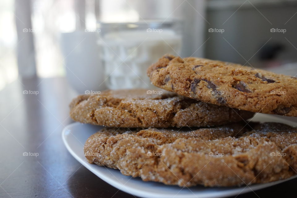 Close-up of milk and cookie