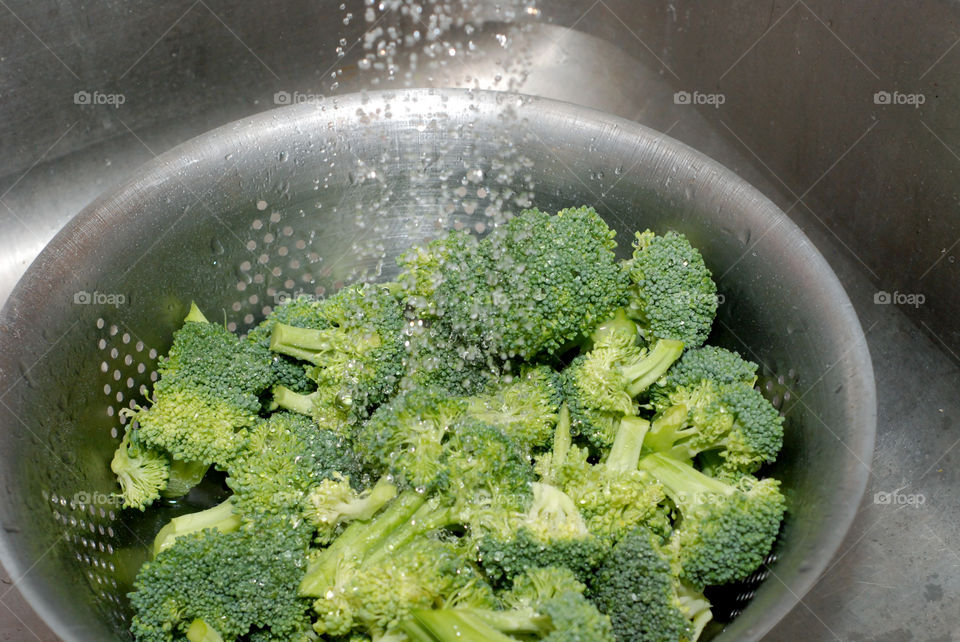 Washing organic broccoli. Organic broccoli