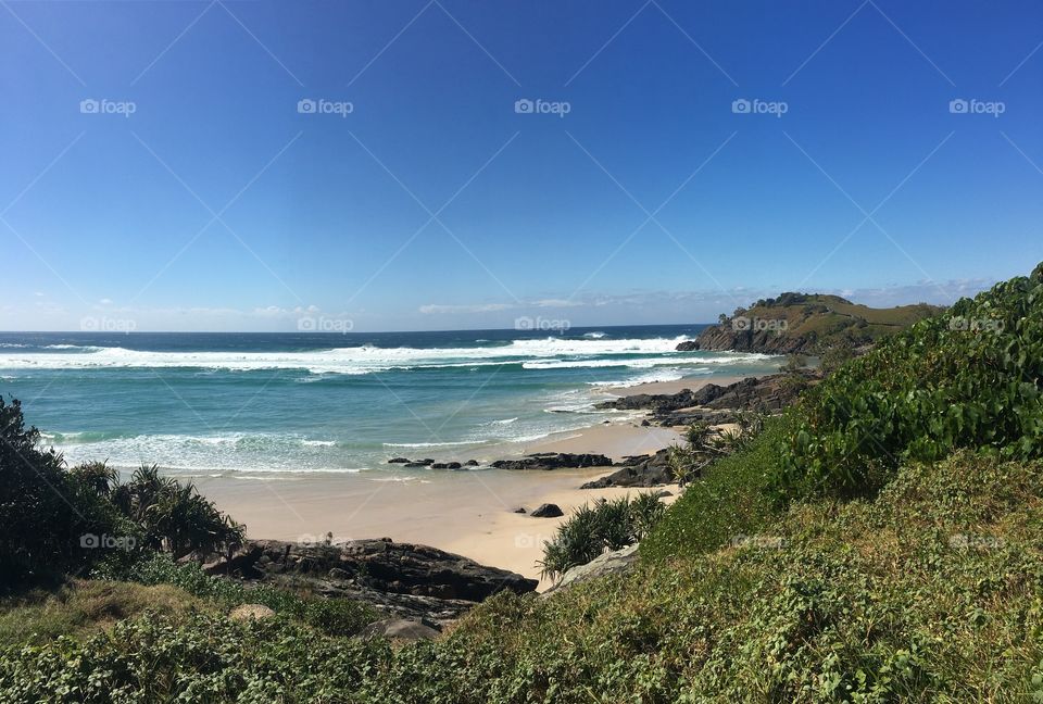 Rolling waves crashing in cove bay