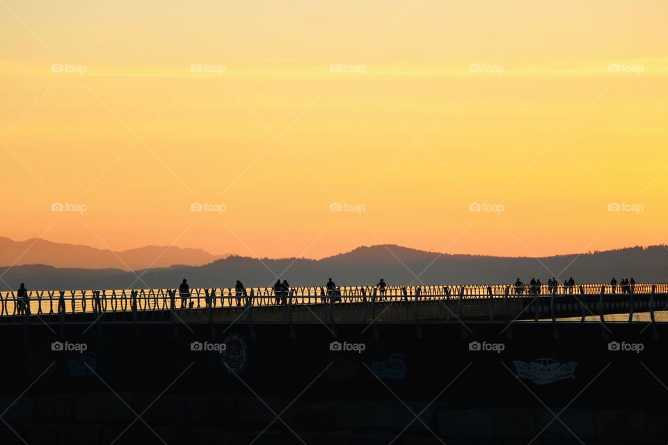 People on a breakwater 