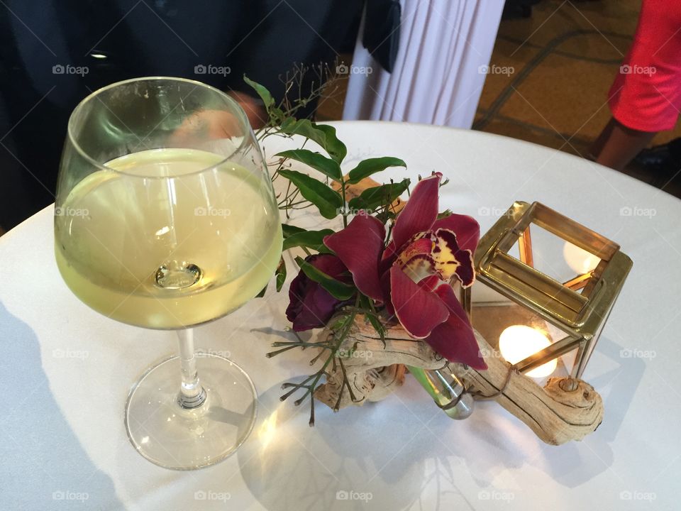 Romantic evening with wine, fresh flowers and candlelight 