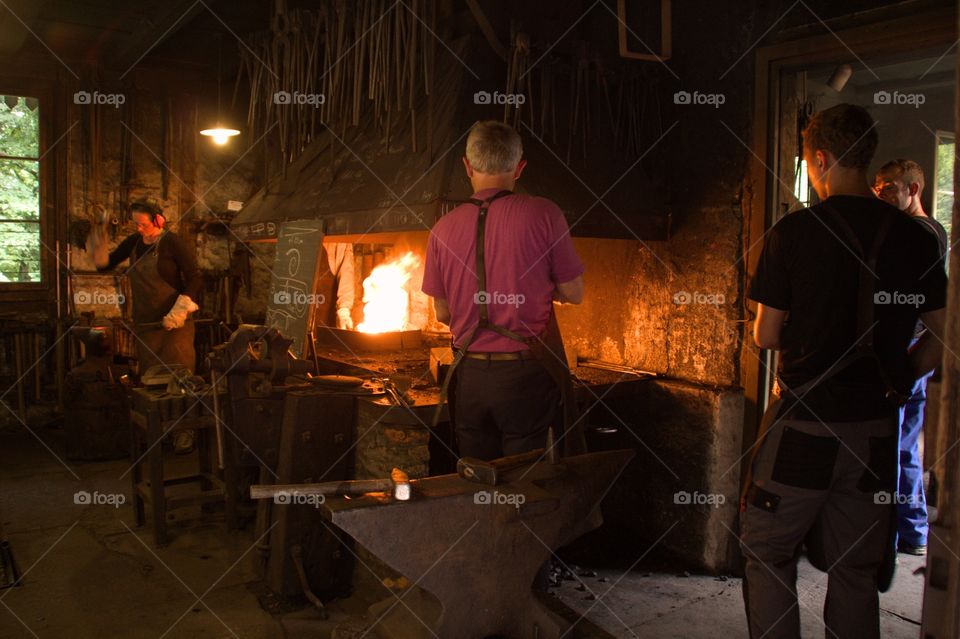 Blacksmith shaping metal