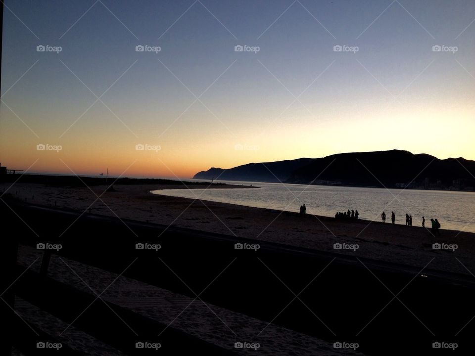 People at the beach by night 