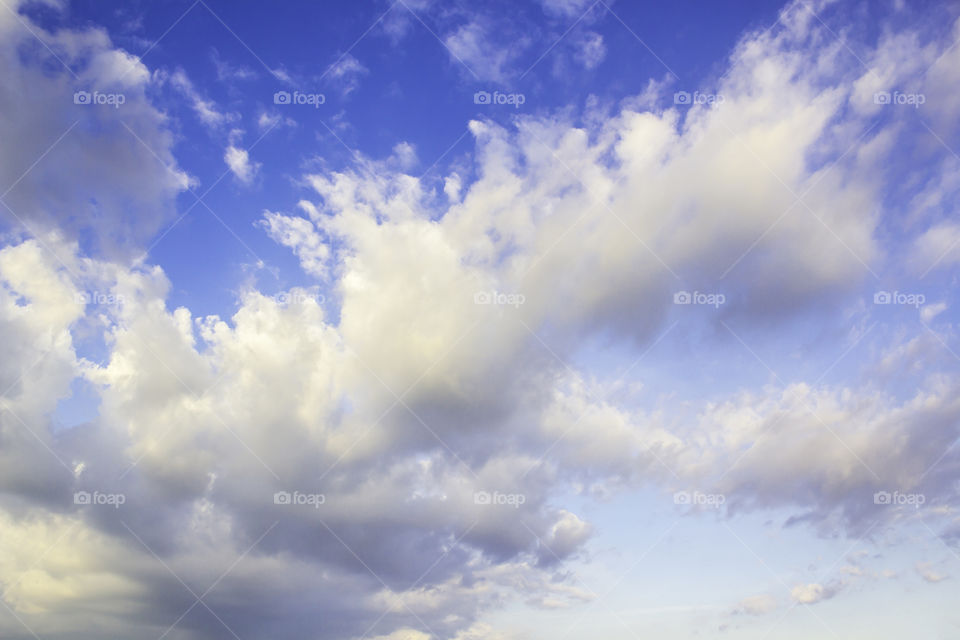 Blue sky with fluffy clouds