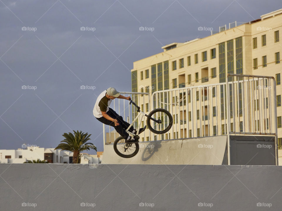 sport with freestyle bike captured jumping in the air on a ramp