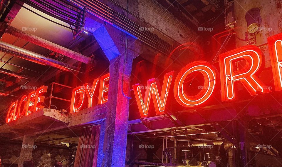 An amazing wedding and reception venue in Philadelphia PA. The brilliant red neon against the blue accent lights look fantastic. Once a working factory from years ago, it has been since transformed into this very modern space.