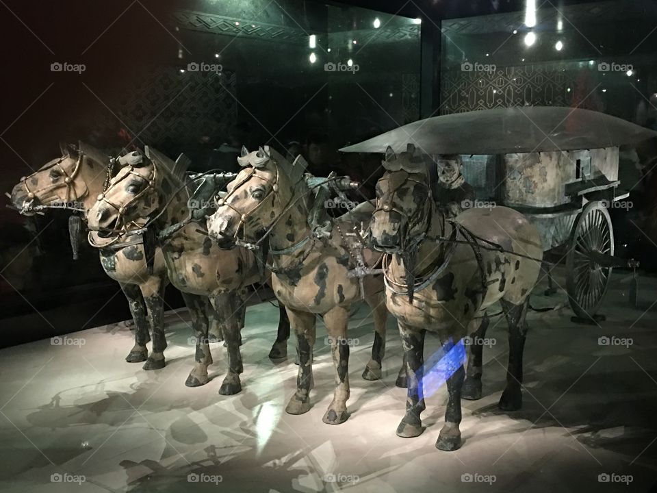 Horse-drawn chariot sculpture, with terra cotta warriors in Xi’an China