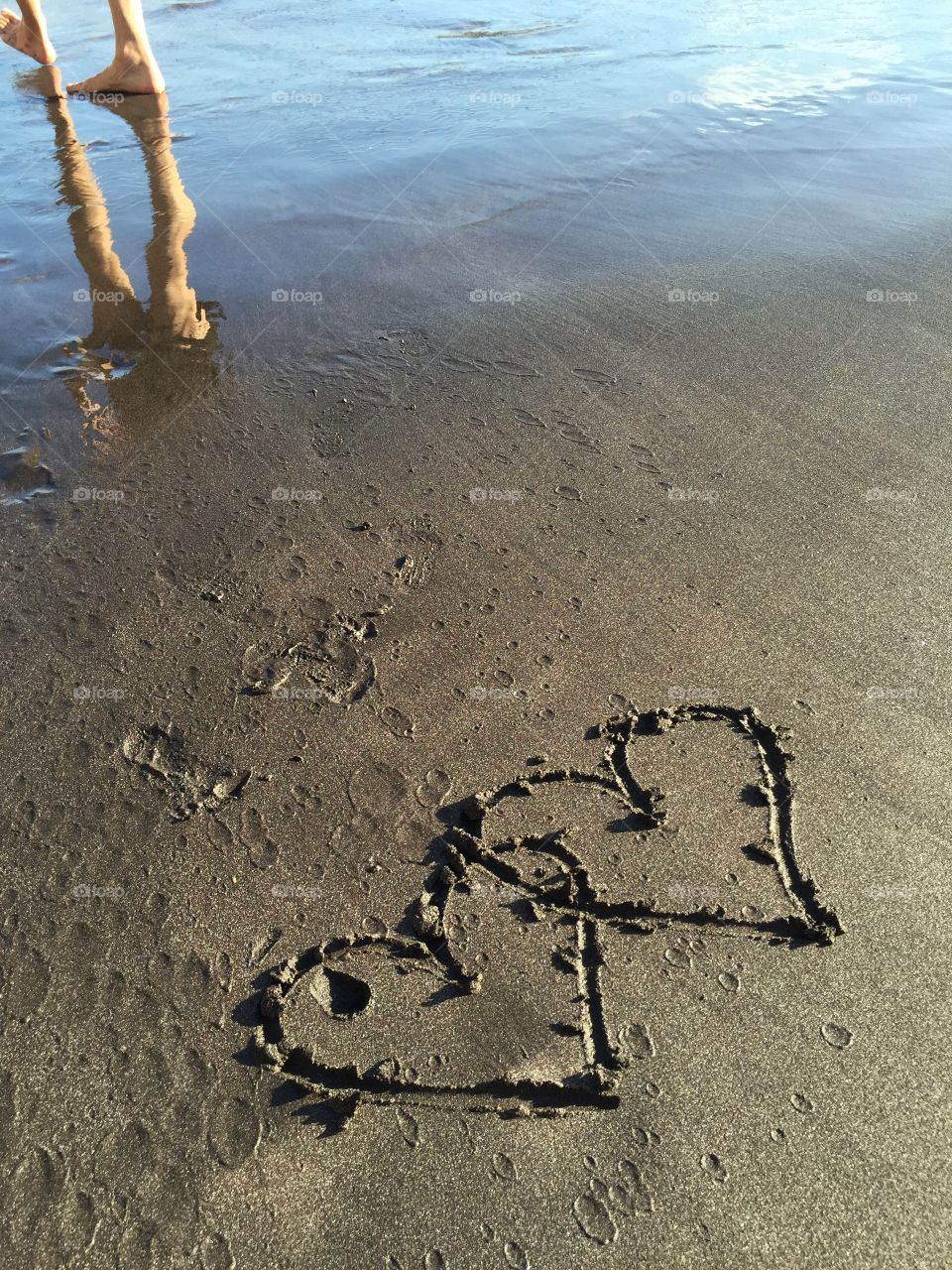 Hearts painted into the black Sand of a Beach in La Gomera