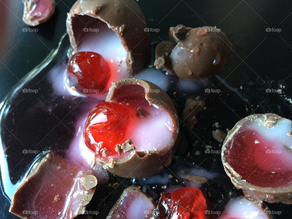 Candied cherries in chocolate shells