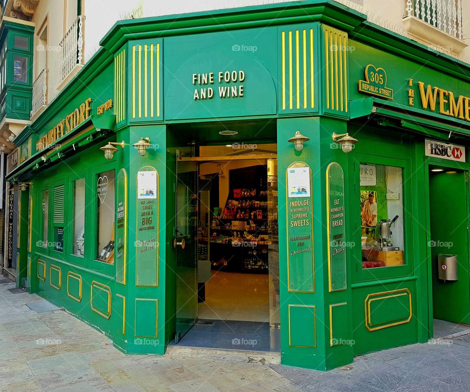 green facade of a shop