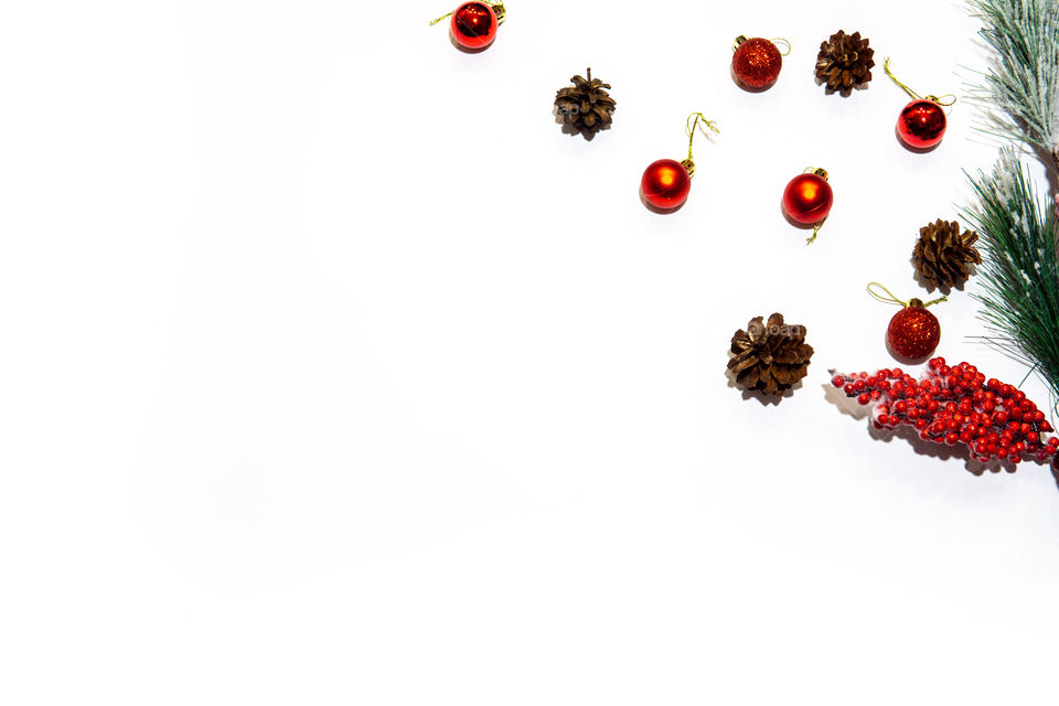 Christmas frame with red decoration and pines in corner