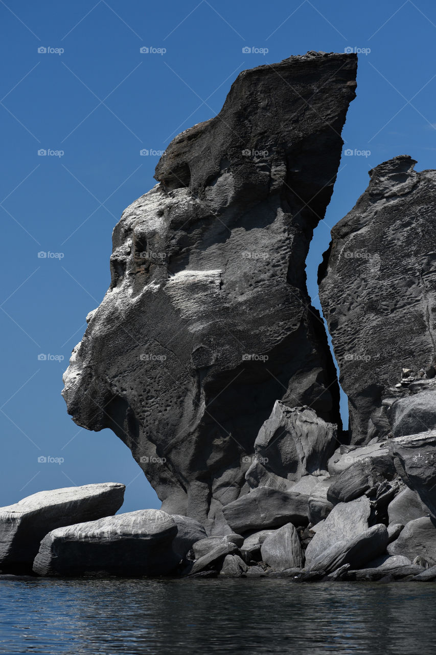 Natural stone formation with gorilla face