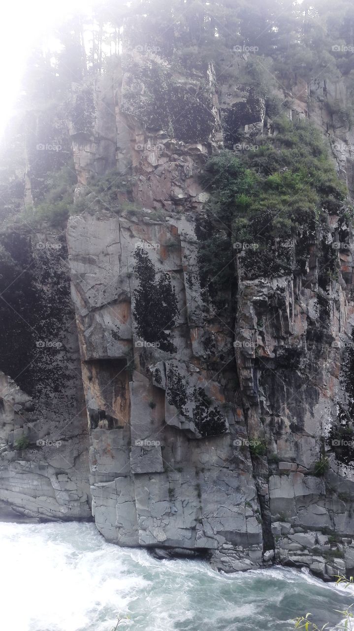 Huge mountains through which Huge waters of "Aharbhul"/River "Washouw" has carved its way for its natural flow to feed so many adjoining Habitations & Irrigation canals in downward areas of Kashmir J&K India.
