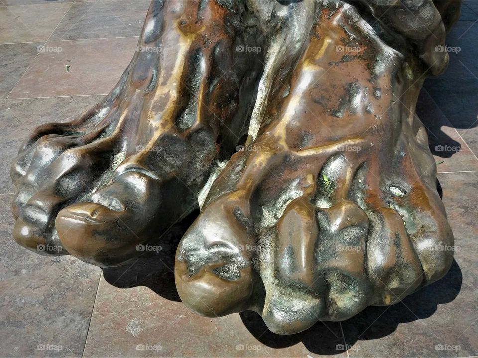 feet of a statue