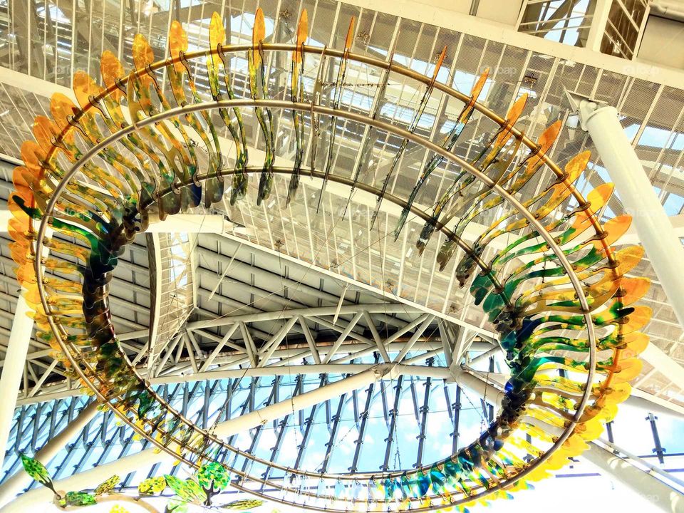 Shapes: Ellipse. A large circular ring decorated in the ceiling of local train station.