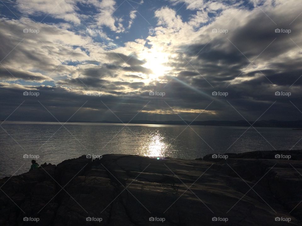 Clouds and sun rays on the sky