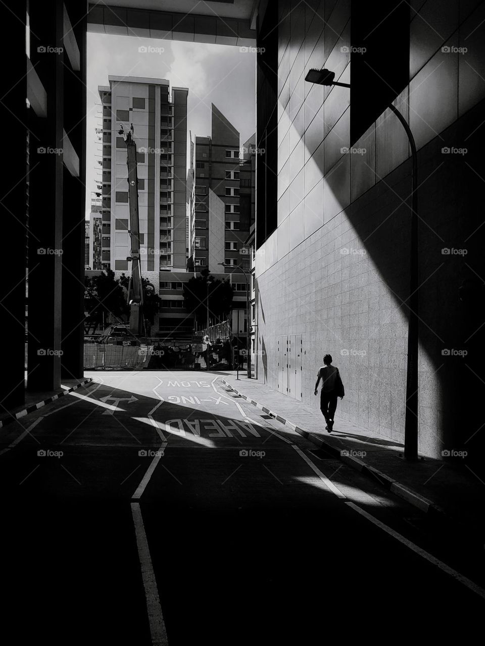 A man walking into the sun light