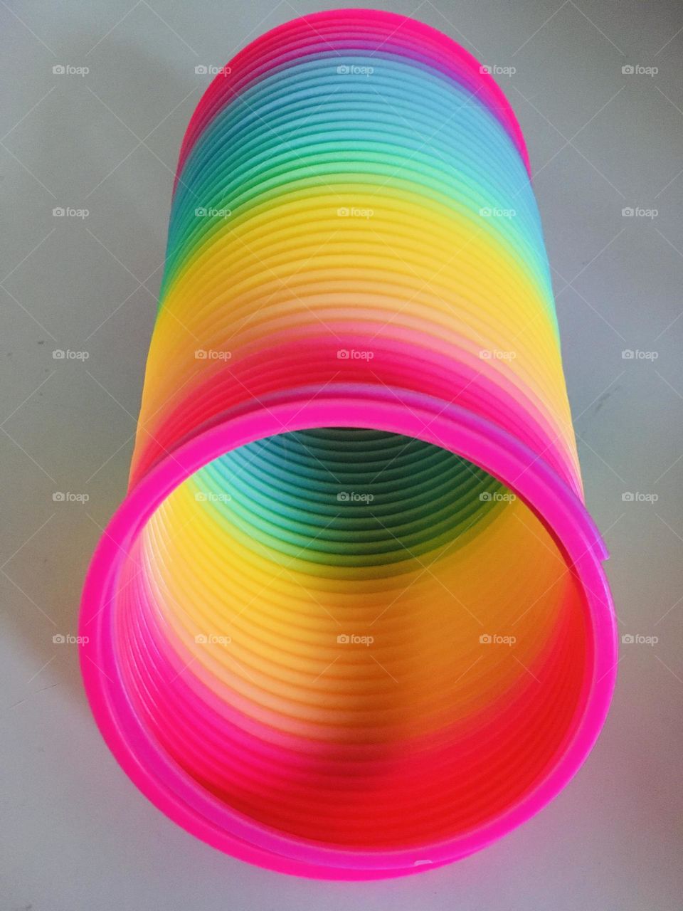 An amazing burst of colour with a white backdrop. Minimalist yet full of joy and vibrancy. Reminds me of my childhood, I just want to grab it and stretch it!