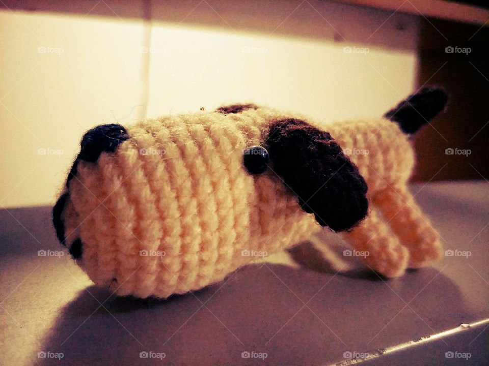 Dog doll made of yarn.