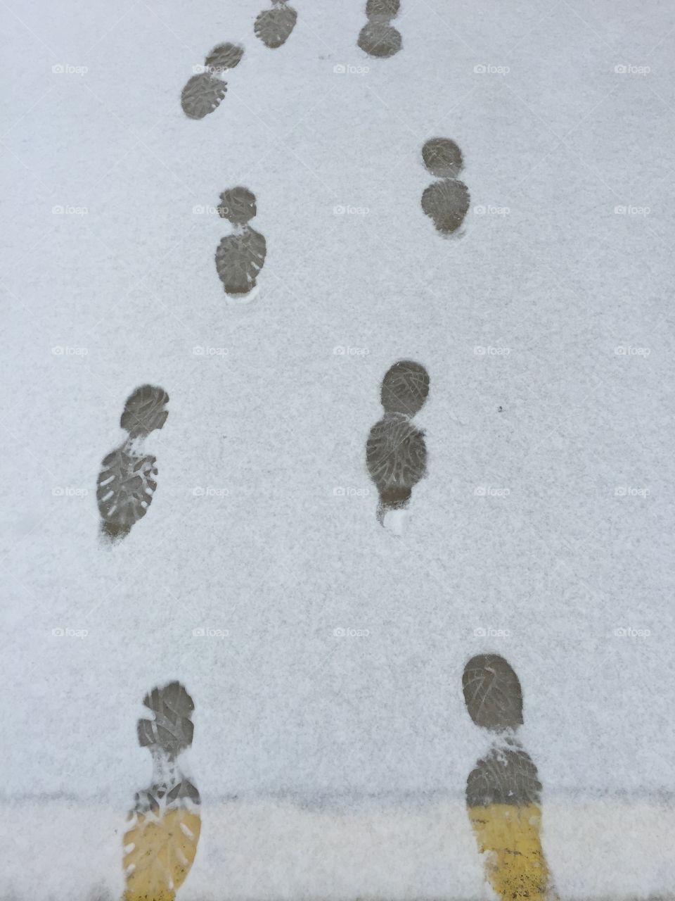 My dad and my footprints in the snow