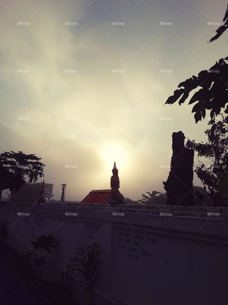 sun rises on Buddha