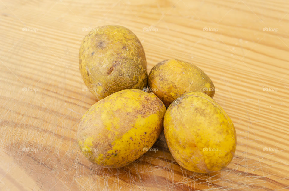 Ripe June Plums On Table Top