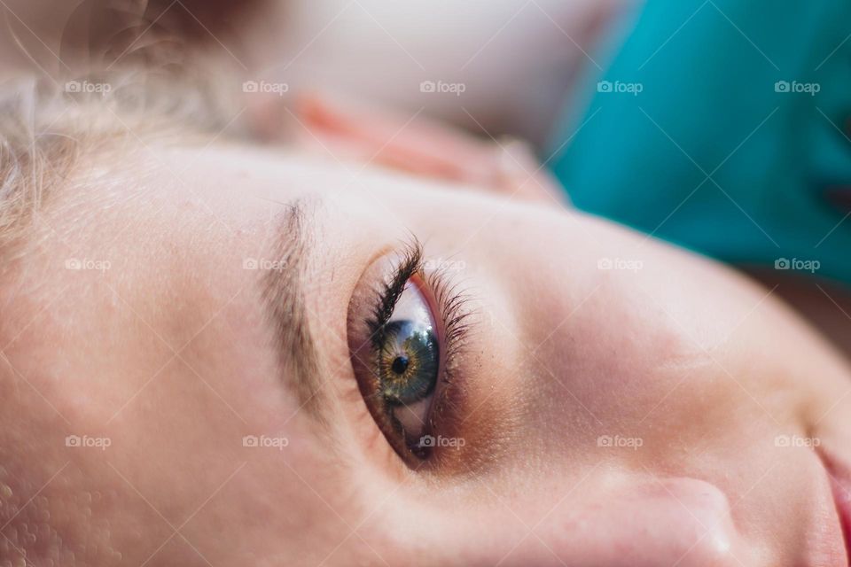 closeup on a blue-green female eye