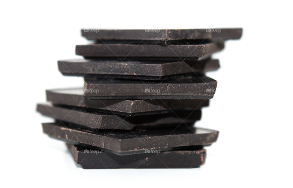 Dark chocolate bars on white background