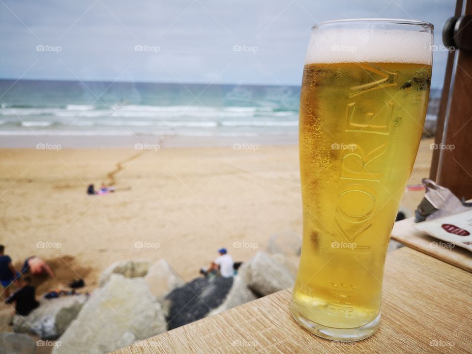 Drinking Lager and overlooking the Beach