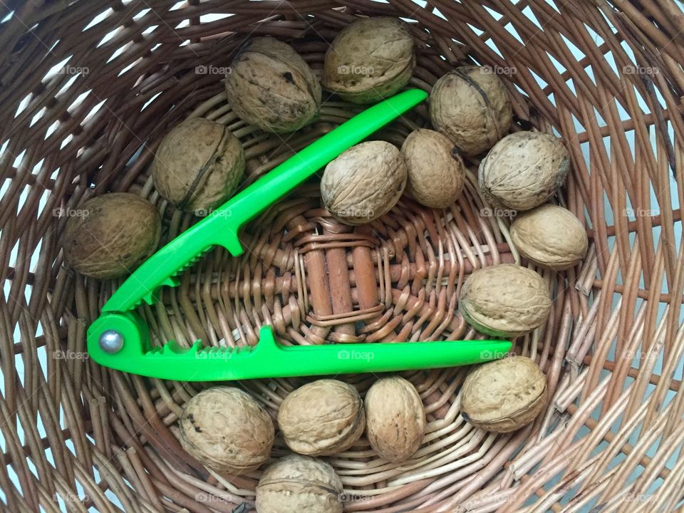 Walnuts in the basket with crackers 