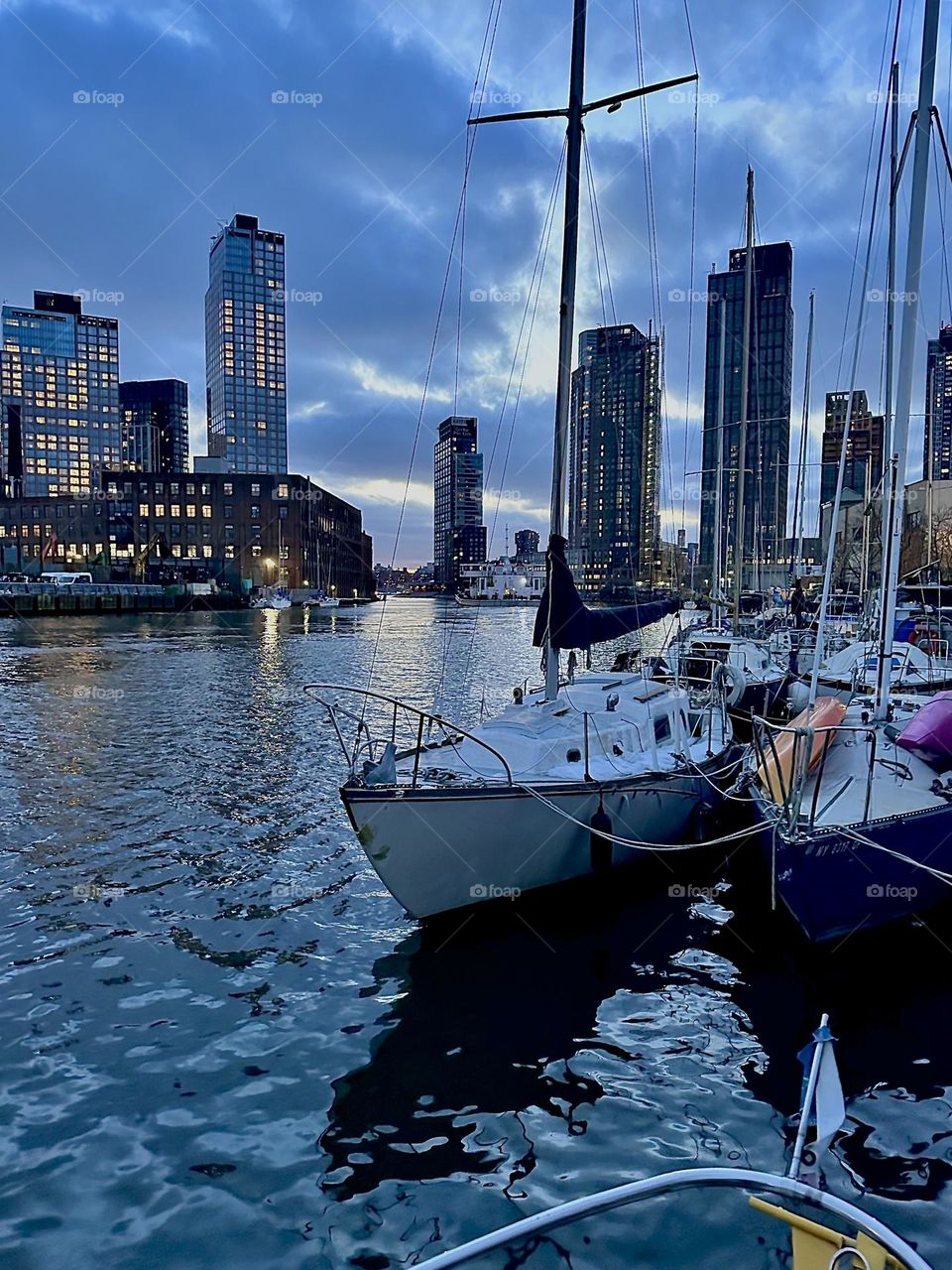 This is “Newtown Creek” by the “Pulaski Bridge” in LIC, Queens in the evening before nightfall. A great variety of boats is tied to the shore here. The best views are from aboard one of them such as ours, the “Salvation”. 2024. Hypnotic Productions